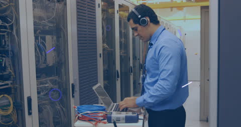 IT Specialist Working on Laptop in Data Center Server Room Network Analysis
