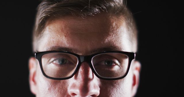 Close up portrait of face of caucasian man wearing glasses with focus on eyes. human vision and sight, eye detail.