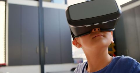 Young Boy Exploring Virtual Reality Classroom Experience
