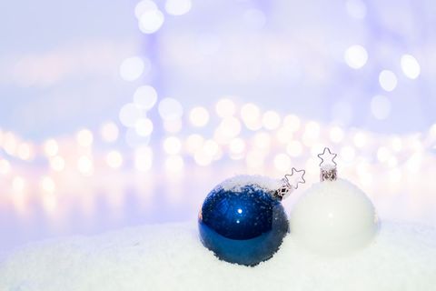 Festive Blue and White Christmas Baubles on Snow