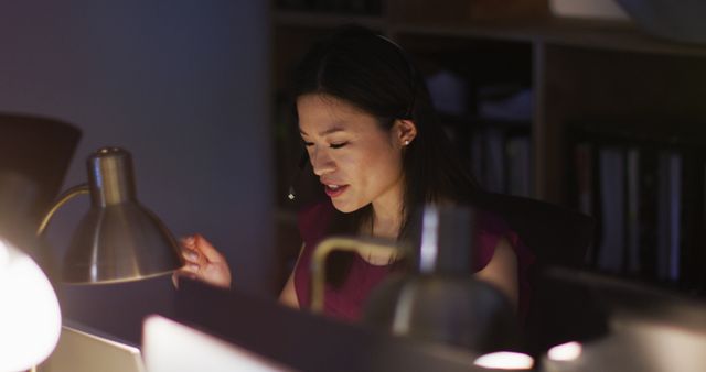 Image of asian female consultant working late in office - Download Free Stock Photos Pikwizard.com