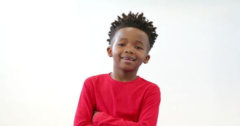 Confident Young Boy in Red Shirt Studio Portrait