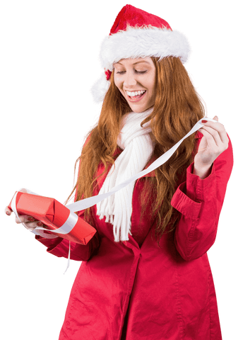 Cheerful Woman in Santa Hat Unwrapping Transparent Christmas Gift