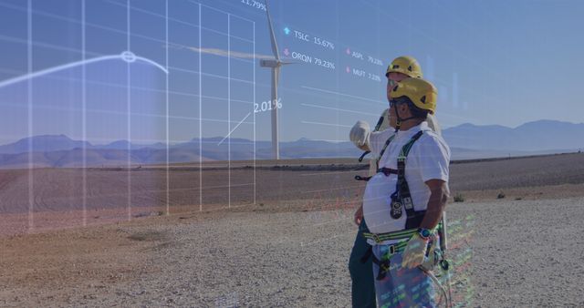 Engineers in safety gear are overseeing a wind turbine farm with real-time data overlay. This image can be used in contexts related to renewable energy, sustainable technology, clean power projects, and data analysis in engineering. Suitable for use in articles, brochures, websites, and presentations promoting green energy solutions.