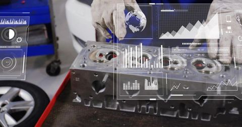Mechanic inspecting aluminum engine head with digital diagnostics hud overlays in workshop