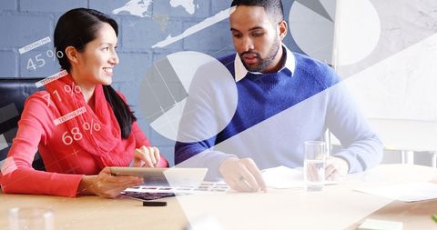 Diverse Professionals Analyzing Financial Data During Meeting