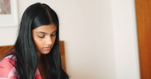 Pensive Young Woman with Long Dark Hair Lost in Thought - Download Free Stock Images Pikwizard.com