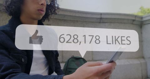 Young Man with Smartphone and Social Media Likes