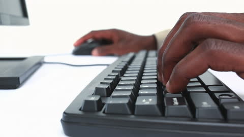 Close-up Hands Typing on Keyboard with White Background