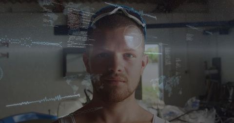 Technician wearing safety goggles interacting with holographic ar overlays in workshop