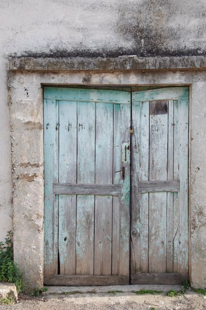 Weathered Old Wooden Door with Peeling Paint and Rustic Surroundings - Download Free Stock Photos Pikwizard.com