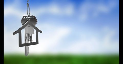 House Key on Keychain with Blurred Nature Background
