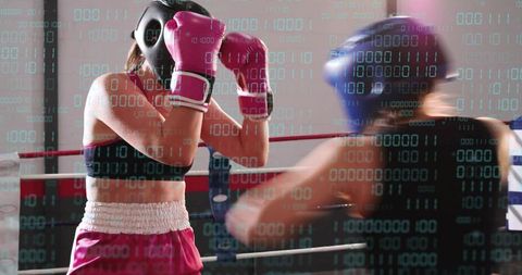 Female boxers sparring in gym ring with binary data overlay representing digital training