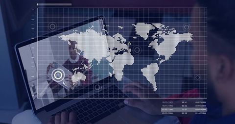 Global data collaboration on laptop with digital world map overlay and coworker teamwork