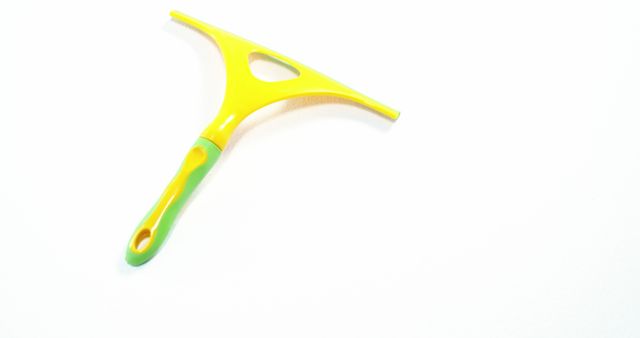 Bright yellow and green squeegee isolated on white background - Download Free Stock Images Pikwizard.com