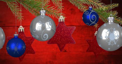 Festive Hanging Christmas Ornaments on Red Background - Download Free Stock Images Pikwizard.com