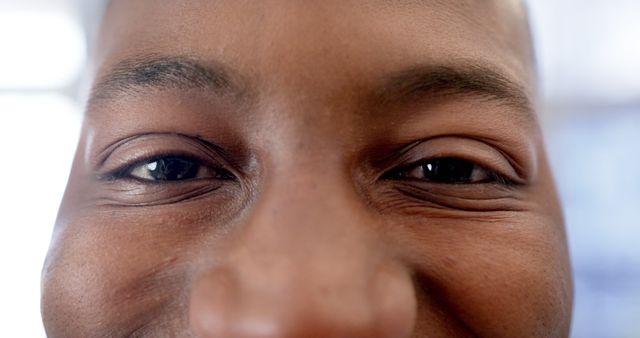 Portrait of happy eyes of african american man in hospital. Medicine, healthcare and medical services, unaltered.