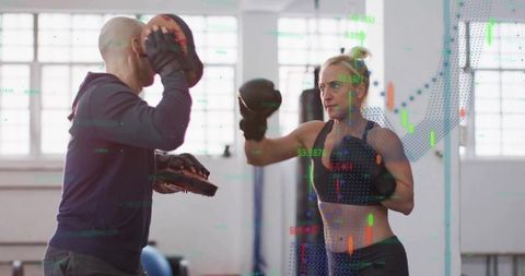 Coach Training Woman in Boxing with Data Overlay