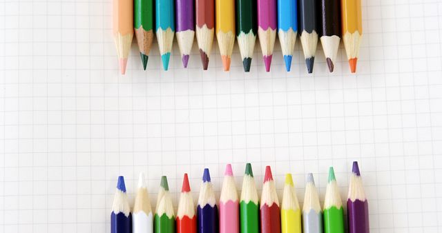 Colorful Colored Pencils Arranged on Grid Paper Background - Download Free Stock Images Pikwizard.com