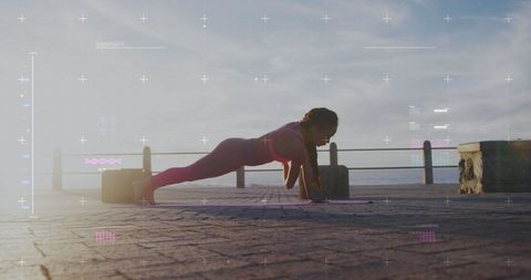 Woman Exercising on Seaside Promenade with Digital Overlay