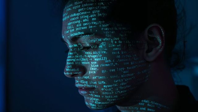 Teal Code Projection on Woman Face Representing Cybersecurity, AI and Digital Identity