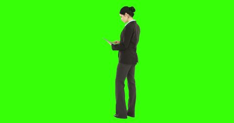 Businessman Engaged with Tablet on Vibrant Green Background