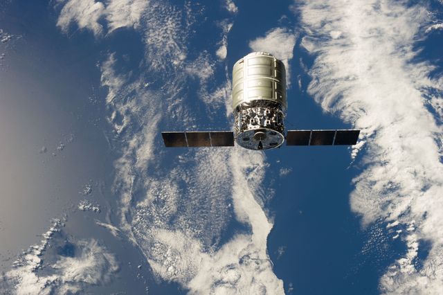 Image displays the first Cygnus commercial cargo spacecraft, built by Orbital Sciences Corp., during its docking with the International Space Station on September 29, 2013. Use for themes related to space exploration, commercial spaceflights, and advancements in aerospace technology.