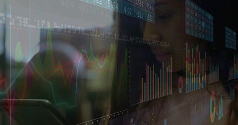 Woman Analyzing Data on Futuristic Dashboard in Office