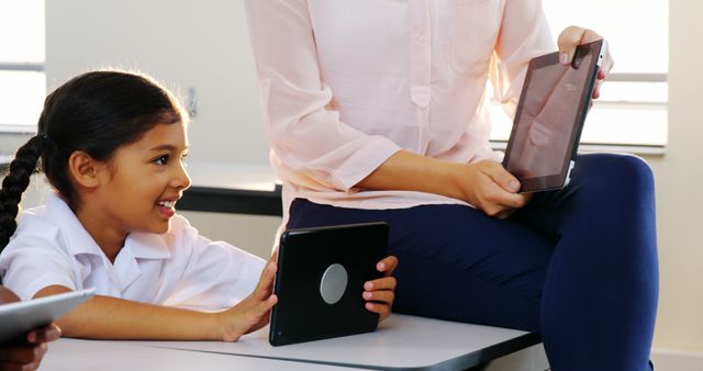 Teacher Helping Student with Tablet Learning in Classroom - Download Free Stock Images Pikwizard.com