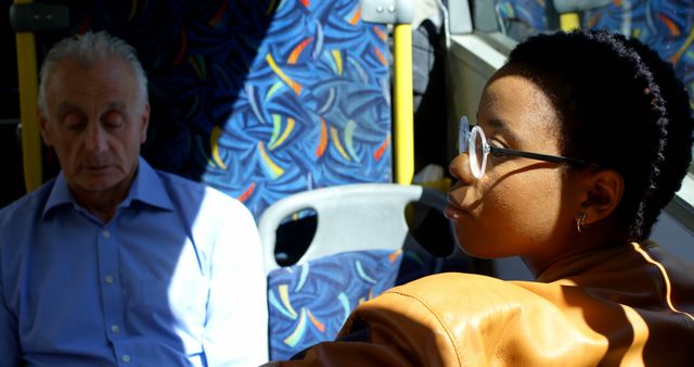 Young Woman in Brown Jacket Sitting Next to Elderly Man on Bus - Download Free Stock Images Pikwizard.com