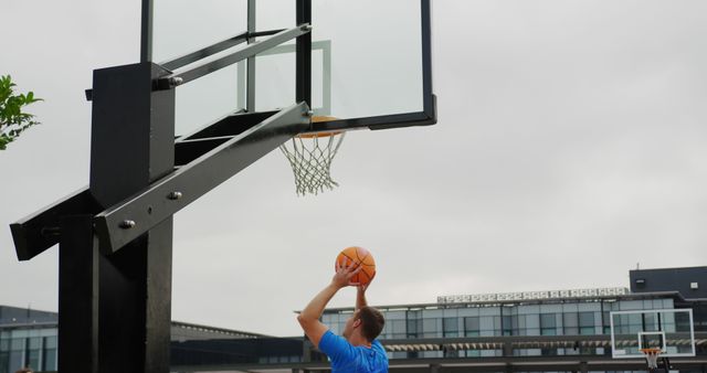 Man Playing Basketball Outdoor Showing Slam Dunk - Download Free Stock Images Pikwizard.com