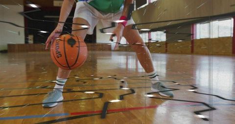 Female Athlete Dribbling Basketball in Indoor Gym with Dynamic Motion Effect