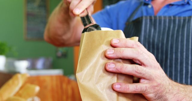 Close-up of Person Bagging Fresh Bread at Bakery - Download Free Stock Images Pikwizard.com