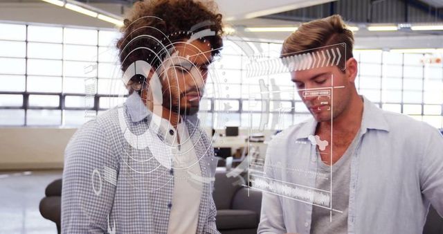 Colleagues Analyzing Data on Digital Interface in Office Space