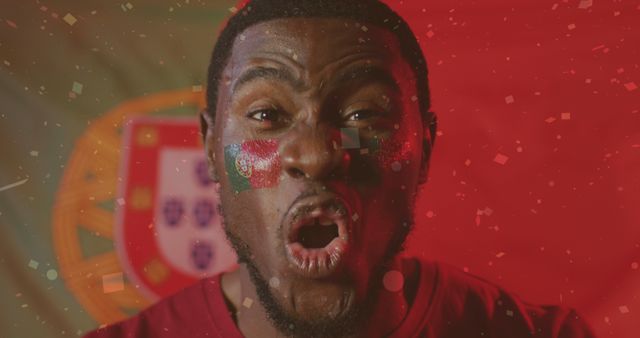 Excited Sports Fan Cheering in Front of Portuguese Flag - Download Free Stock Images Pikwizard.com