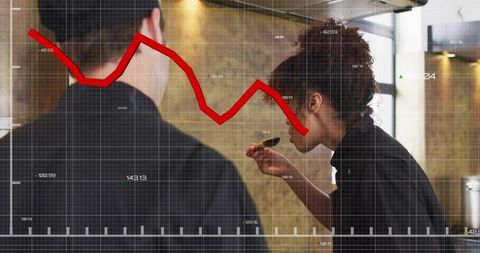 Chef tasting spoon while red trend line shows decline overlaid on modern kitchen