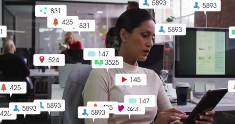Businesswoman analyzing social media engagement on tablet