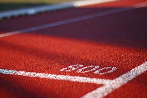 Close-up of sports running track with lane numbering