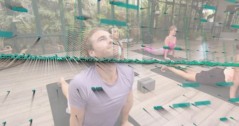 Group Yoga Backbend in Glass Studio with Lush Greenery and Teal Tech Overlay