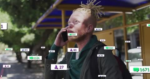 Man Connects with Digital World while Waiting at Bus Stop