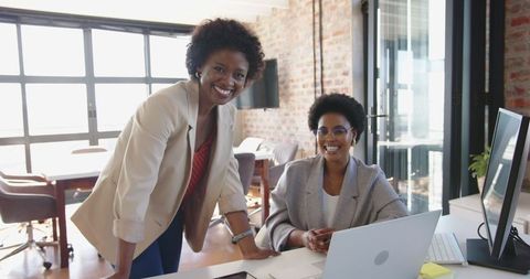 African American Colleagues Collaborating in Modern Office Environment
