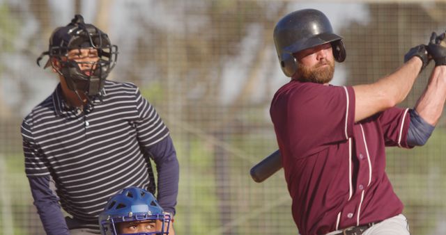 Baseball Batter Swinging During Game with Umpire and Catcher - Download Free Stock Images Pikwizard.com