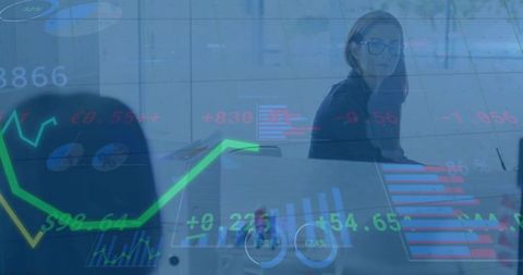 Businesswoman presenting financial charts and dashboard visualization in modern boardroom