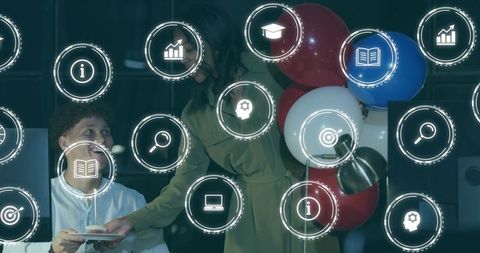 Team celebrating office birthday with cupcake and balloons amid digital HUD icons overlay