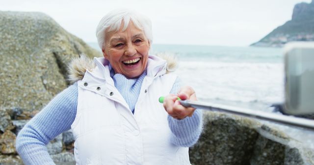 Senior Woman Smiling and Taking Selfie on Beach - Download Free Stock Images Pikwizard.com