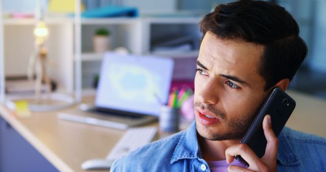 Young Professional on Phone Call in Modern Office - Download Free Stock Images Pikwizard.com