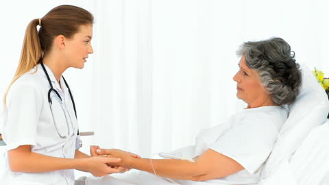 Dedicated Nurse Checking Elderly Patient's Pulse