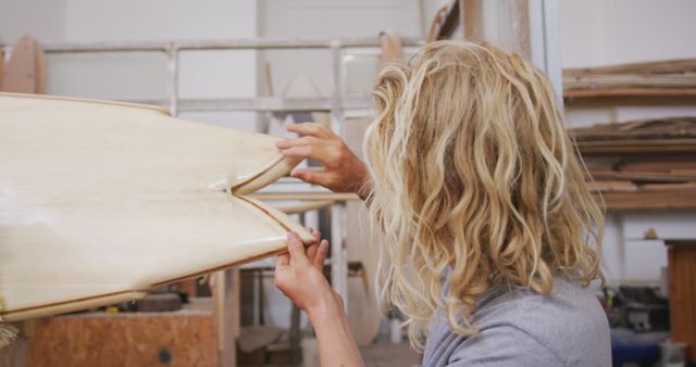 Surfboard Maker Inspecting Custom Board In Workshop - Download Free Stock Images Pikwizard.com