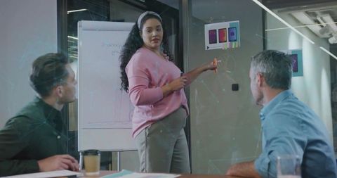 Pregnant Woman Leading Team Meeting in Modern Office