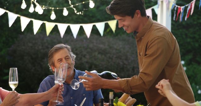 Family Celebrating Outside with Champaign During Evening Meal - Download Free Stock Images Pikwizard.com